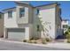 Beautiful new two-story home featuring an attached garage and well manicured landscaping in a modern community at 7017 Magenta Moon St, North Las Vegas, NV 89086