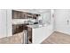 Modern kitchen featuring stainless steel appliances, granite countertops, and dark wood cabinets at 7017 Magenta Moon St, North Las Vegas, NV 89086