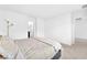 Neutral bedroom featuring a comfortable bed and carpeted floors at 7017 Magenta Moon St, North Las Vegas, NV 89086