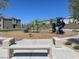 Community playground with climbing structures, slides, and bench seating for Gathering fun at 7017 Magenta Moon St, North Las Vegas, NV 89086