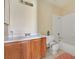 Bathroom with white tile and wood vanity at 7054 Burcot Ave # G40, Las Vegas, NV 89156