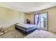 Bedroom featuring natural light, a bed, and neutral colored walls at 7054 Burcot Ave # G40, Las Vegas, NV 89156