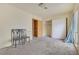 A bright bedroom with a window, closet, and doorway provides comfort and functionality at 7054 Burcot Ave # G40, Las Vegas, NV 89156