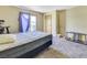 Bedroom featuring natural light, a bed, and neutral colored walls at 7054 Burcot Ave # G40, Las Vegas, NV 89156