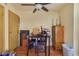 Dining room with table, ceiling fan, wood floors, and storage at 7054 Burcot Ave # G40, Las Vegas, NV 89156