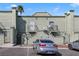 Back side of building featuring balconies and permit parking at 7054 Burcot Ave # G40, Las Vegas, NV 89156