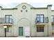 Two-story building featuring quaint balconies and neutral stucco façade at 7054 Burcot Ave # G40, Las Vegas, NV 89156
