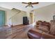 A living room featuring wood floors and dark brown leather sofa at 7054 Burcot Ave # G40, Las Vegas, NV 89156