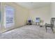 A bright living room offers balcony access and ample natural light, perfect for relaxation or entertaining at 7054 Burcot Ave # G40, Las Vegas, NV 89156
