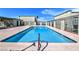 Community pool with clear blue water and ample space for residents to relax and enjoy the outdoor amenities at 7054 Burcot Ave # G40, Las Vegas, NV 89156