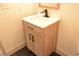 Bathroom with a modern vanity, quartz countertop, and updated fixtures at 8101 Spur Ct, Las Vegas, NV 89145