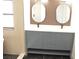 Bathroom featuring double vanity with marble countertop, modern mirrors, and updated cabinets at 8101 Spur Ct, Las Vegas, NV 89145