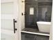 Modern bathroom featuring a walk-in shower with black marble tile and soaking tub at 8101 Spur Ct, Las Vegas, NV 89145
