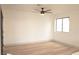 Bright bedroom with a ceiling fan, hardwood floors, and modern style at 8101 Spur Ct, Las Vegas, NV 89145