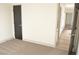 Bedroom with carpet and doorway, offering a glimpse into the home's layout at 8101 Spur Ct, Las Vegas, NV 89145