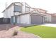 Inviting two-story home featuring a manicured lawn, a two-car garage, and a charming aqua-colored front door at 8101 Spur Ct, Las Vegas, NV 89145