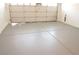 Spacious two-car garage featuring a light gray epoxy floor at 8101 Spur Ct, Las Vegas, NV 89145