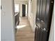 Bright hallway with wood floors and white walls showcasing the home's open layout at 8101 Spur Ct, Las Vegas, NV 89145