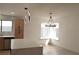 Modern kitchen featuring an island, stainless steel appliances, and contemporary lighting at 8101 Spur Ct, Las Vegas, NV 89145