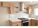 Kitchen featuring stainless steel appliances, light colored cabinets, white backsplash and quartz countertops at 8101 Spur Ct, Las Vegas, NV 89145
