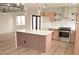 Spacious kitchen with a quartz island, stainless steel appliances, and an open layout at 8101 Spur Ct, Las Vegas, NV 89145