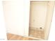 Interior laundry closet with colorful patterned tile flooring and shelving at 8101 Spur Ct, Las Vegas, NV 89145