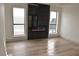 Bright living room with modern fireplace and hardwood floors offering a comfortable and stylish space at 8101 Spur Ct, Las Vegas, NV 89145