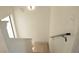 Bright staircase features modern railing, light wood floors, and a well-lit landing at 8101 Spur Ct, Las Vegas, NV 89145