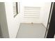 Small room with gray herringbone floors and storage at 8101 Spur Ct, Las Vegas, NV 89145