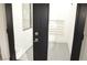 Small room with gray herringbone floors and door leading outside at 8101 Spur Ct, Las Vegas, NV 89145