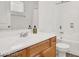 Bright bathroom with a tub and a sink with wood cabinets at 9050 W Tropicana Ave # 1009, Las Vegas, NV 89147