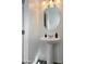 Bathroom features a pedestal sink, mirror, and modern fixtures in a compact space at 9050 W Tropicana Ave # 1009, Las Vegas, NV 89147