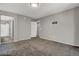 Neutral bedroom with grey carpeting and bathroom access provides a blank canvas at 9050 W Tropicana Ave # 1009, Las Vegas, NV 89147
