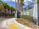 Inviting community entrance with modern signage, lush landscaping, and secure access for peace of mind at 9050 W Tropicana Ave # 1009, Las Vegas, NV 89147