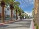 Gated community entrance adorned with palm trees, offering privacy and a welcoming atmosphere at 9050 W Tropicana Ave # 1009, Las Vegas, NV 89147