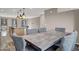 Dining area with modern lighting fixture, a large wood table, and hardwood floors at 9050 W Tropicana Ave # 1009, Las Vegas, NV 89147