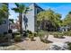 Beautiful exterior view of a modern condo building with a well-maintained landscape design at 9050 W Tropicana Ave # 1009, Las Vegas, NV 89147