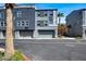A modern townhome complex with private garages and landscaped entryways showcase curb appeal at 9050 W Tropicana Ave # 1009, Las Vegas, NV 89147