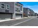 A modern townhome complex with private garages showcases curb appeal at 9050 W Tropicana Ave # 1009, Las Vegas, NV 89147