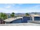 A modern exterior view showcasing the architecture and desert landscaping, set against a mountain backdrop at 9050 W Tropicana Ave # 1009, Las Vegas, NV 89147