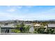 A modern exterior view showcases the architecture with palm trees and city skyline in the background at 9050 W Tropicana Ave # 1009, Las Vegas, NV 89147