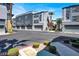 A modern townhome complex with private garages, landscaped entryways, and a well-maintained community at 9050 W Tropicana Ave # 1009, Las Vegas, NV 89147