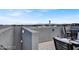 Private rooftop deck features seating and views of the surrounding neighborhood at 9050 W Tropicana Ave # 1009, Las Vegas, NV 89147