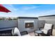 Rooftop terrace with stylish furniture and a built-in fireplace perfect for relaxing at 9050 W Tropicana Ave # 1009, Las Vegas, NV 89147