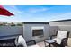 Rooftop terrace with stylish furniture and a built-in fireplace perfect for relaxing at 9050 W Tropicana Ave # 1009, Las Vegas, NV 89147