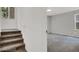 Carpeted staircase with neutral decor lead into the bright living area at 9050 W Tropicana Ave # 1009, Las Vegas, NV 89147