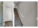Staircase with modern design, white railings and gray stairs leads to the upper level of the home at 9050 W Tropicana Ave # 1009, Las Vegas, NV 89147