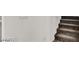 Carpeted stairway with white walls leading to the upper levels of the house at 9050 W Tropicana Ave # 1009, Las Vegas, NV 89147