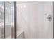 Bright bathroom featuring white tile shower with built-in bench at 1010 Armillaria St, Henderson, NV 89011