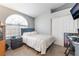 Comfortable bedroom with plush carpet, a large window, and a wardrobe at 1010 Armillaria St, Henderson, NV 89011
